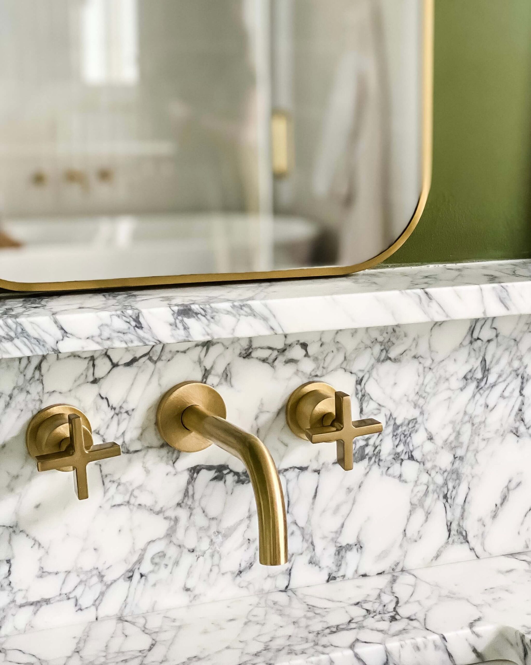 bathroom interior designer-modern-brass-wall-mounted-faucet