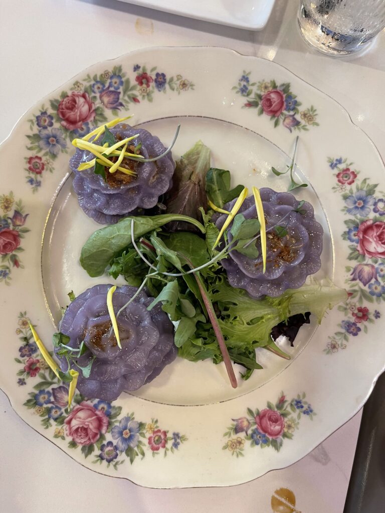 purple dumplings on a pretty plate