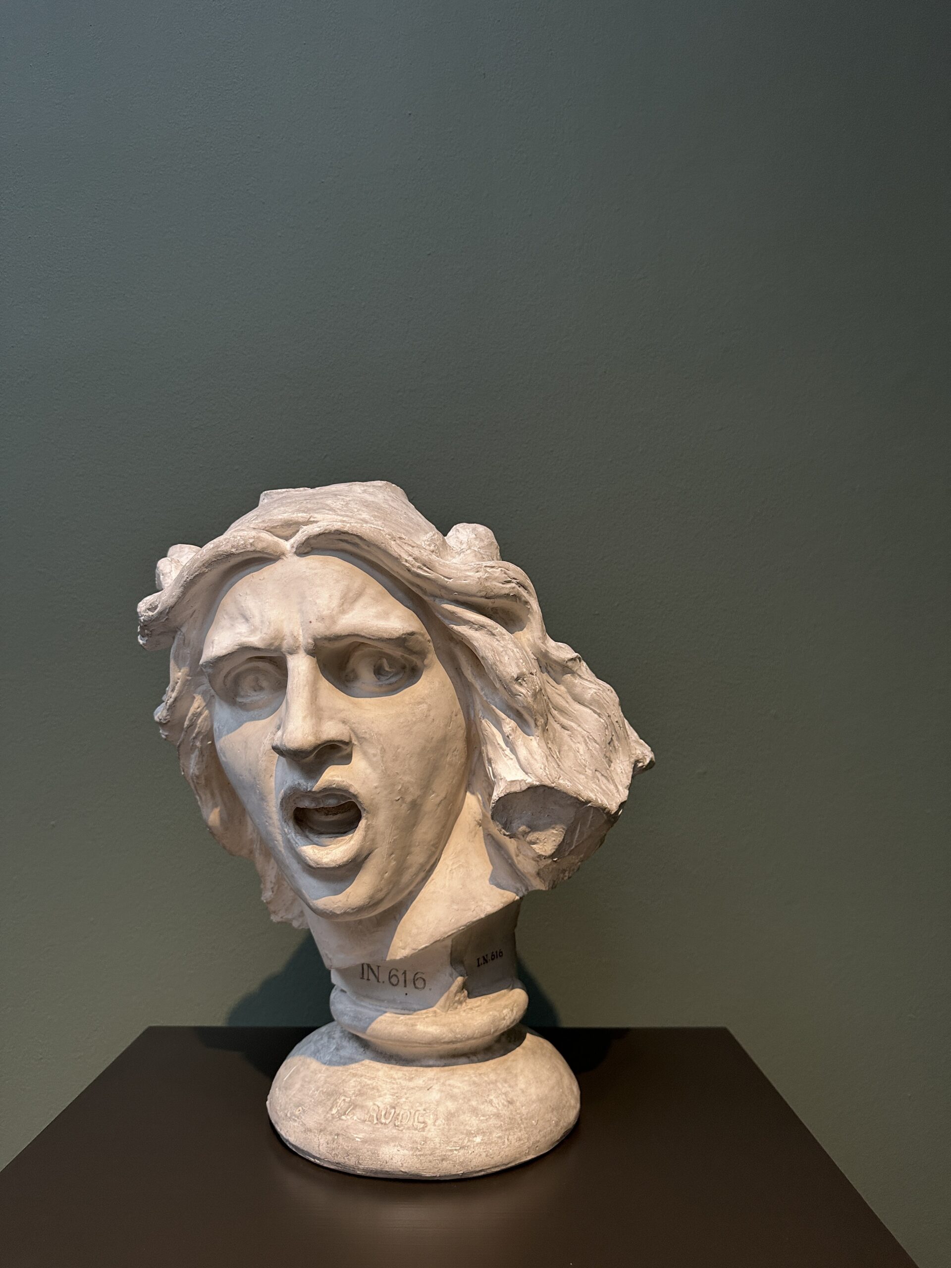 a bust with a shocked expression